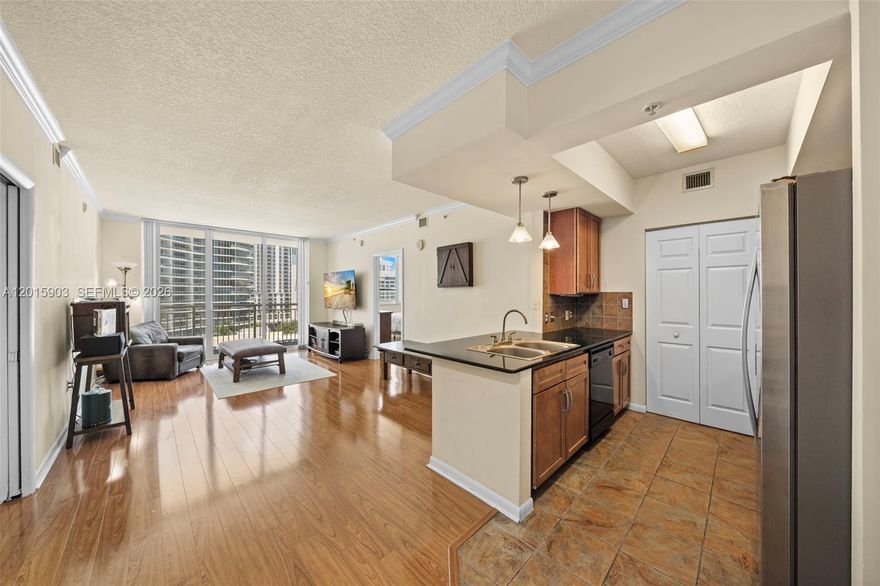 A two-bedroom, two-bath residence at Cité with Biscayne Bay views from every room, a private balcony, and one of Edgewater's most walkable addresses. The open layout brings in natural light and offers a living and dining area generous enough to comfortably fit a 6-person dining table. Wood laminate flooring flows throughout, and the primary bedroom features a walk-in closet, while the primary bath boasts a double sink. Additional highlights include generous closet space, an in-unit washer and dryer, and one parking space. Strong value for the location, the views, and the building.
Cité residents enjoy premium building amenities including valet, concierge, a fitness center, pool and jacuzzi, business center, and a club room with billiards. The building sits directly across from Margaret Pace Park, with walking paths, soccer fields, and tennis, basketball, and volleyball courts. Publix, Whole Foods, the Miami Trolley, restaurants, shops, museums, concerts, and top charter schools are all minutes away, with quick access to the highways, the airport, and the beaches.