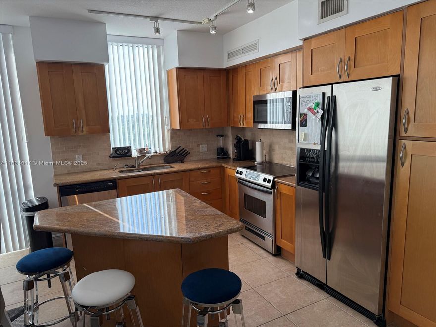 BEAUTIFUL 2-BED CORNER UNIT, VIEWS OF GOLF COURSE. STAINLESS STEEL APPLIANCES, GRANITE COUNTER-TOPS; MARBLE FLOOR. 1 PARKING SPACES SECOND CAR COMPLIMENTARY VALET. JUST WALKING TO THE BEAC STEPS AWAY FROM SHOPS AND RESTAURANT & COFFE SHOPS .POSSIBILY THE BEST DEAL  IN THE BUILDING FOR THE 2BED-2BATH. PLEANTY AMENITIES: POOL, JACUZZI, TENNIS, SPA & FITNESS CENTER, MOVIE THEATRE, BILLIARDS.ASSOCIATION FEE INCLUDE CABLE,WATER,INTERNET AND MAINTENANCE AGREEMENT FOR APPLIANCES AND PLUMBING WITH TOTAL APPLIANCES.  MUST SEE