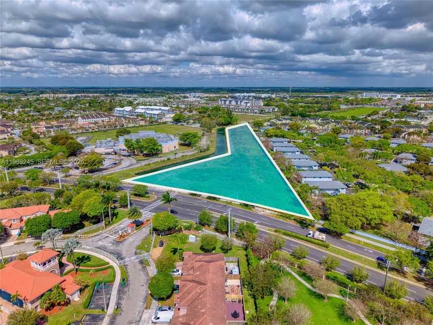 This development site represents one of the lowest price-per-acre opportunities in the Naranja/South Miami-Dade market, offered at $976,335 per acre-delivering exceptional value for investors and developers alike.  The property is zoned R-Edge within the Naranja Community Urban Center District, allowing multifamily developments.  The site is comprised of 3 folios totaling 3.38 acres, with an allowable FAR of 3.7. The seller is currently in the process of obtaining ASPR approvals for a 66-unit garden-style multifamily project.  Additionally under the Live Local Act, the site may qualify for a density increase of up to 90 units, subject to verification of eligibility and compliance with program requirements.  Located directly across from a school and with convenient access to US1, public transit, the Florida Turnpike and major commercial corridors.  The site is also located next to a canal which adds a nice buffer and flexibility for site design.