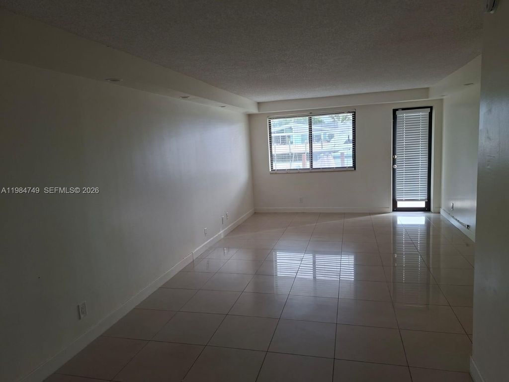 Photo of 301 Golden Isles Dr #110, Hallandale Beach, FL 33009 (MLS # A11984749)