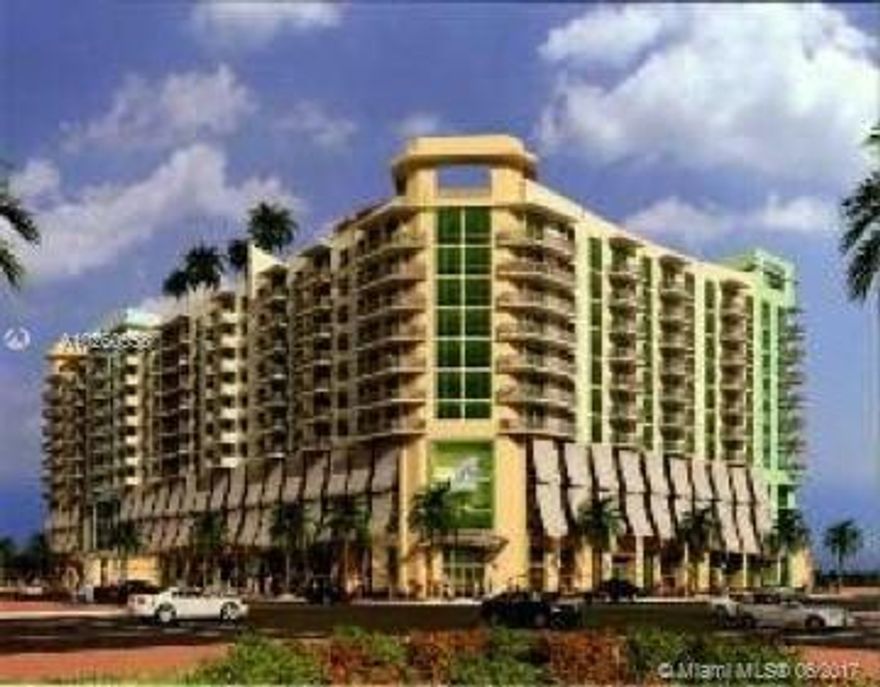 Spacious two bedroom plus a den, high floor, with large balcony facing the pool, at desirable downtown Hollywood Station. Walk to shops, restaurants and night life, a short bike ride from Hollywood beach. European style kitchen with stainless steel appliances, self cleaning oven, granite/marble countertops. Unit is freshly painted with NEW WOOD FLOORS and new carpet installed! Building has valet, 24 hours concierge at lobby, pool, jacuzzi, gym, and a party room with billiards. Won't last!