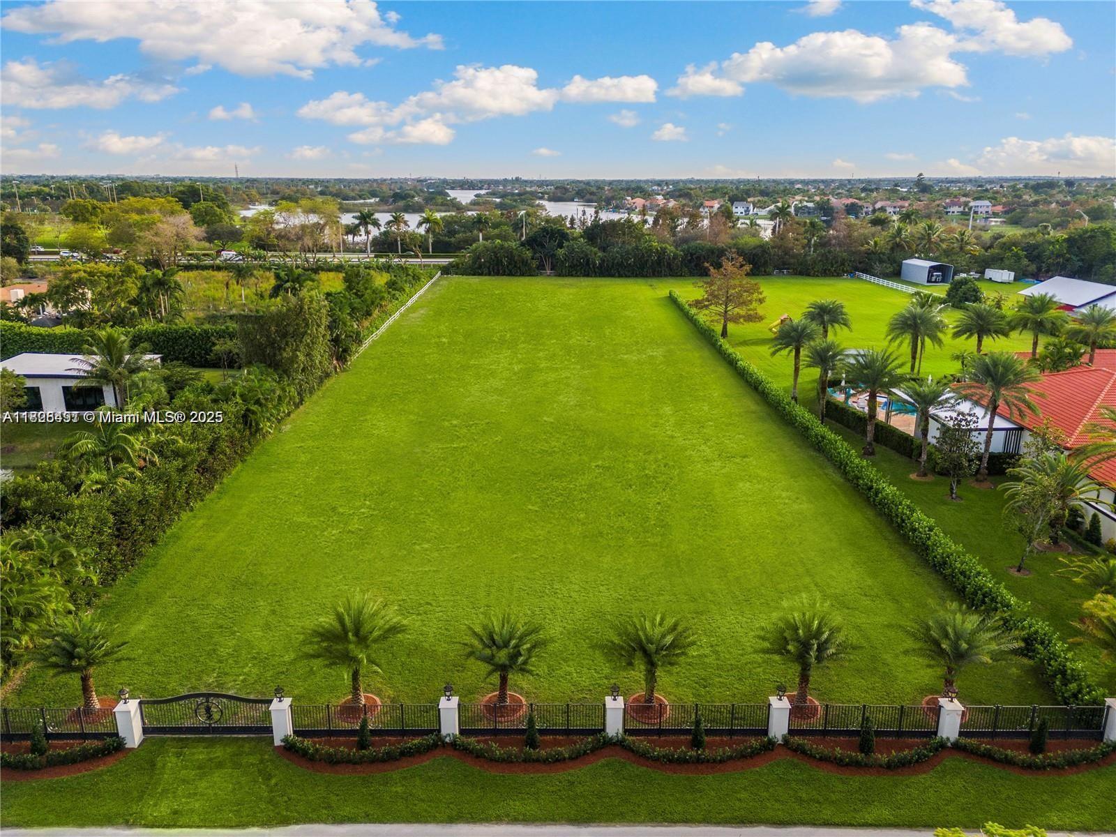 This expansive 2.24 acre lot in the highly desirable Southwest Ranches offers a prime opportunity to build your dream estate! The land has already been filled and thoughtfully improved with a private electric gate, offering both security and a head start for future development! Situated on a peaceful street with a cul-de-sac and minimal traffic. Please call to schedule an appointment to walk the lot. The neighboring home on an additional 2.24 acre lot is also available, presenting a rare opportunity to acquire both properties and ~4.5 acres in a combined sale! Open House Saturday and Sunday!