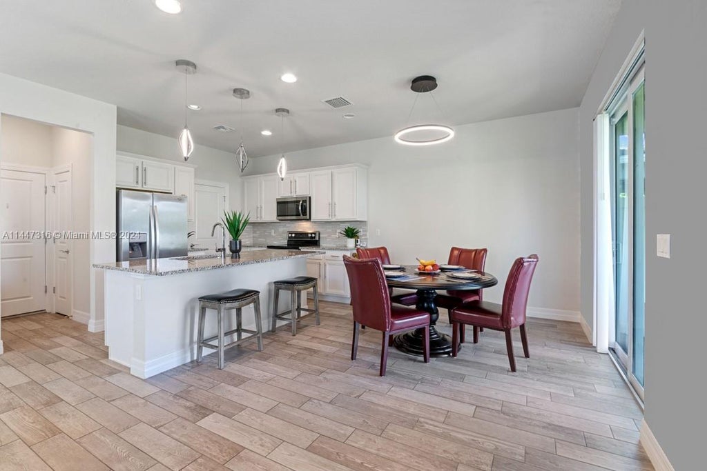 Photo of 4111 Large Leaf Ln, Hollywood, FL 33021 (MLS # A11447316)
