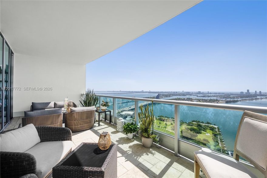A rare high-floor 1 bedroom + den, 2 full bathroom residence with 10-foot ceilings, a 246 sq. ft. private balcony, an expanded built-out closet, and a large primary bathroom with dual sinks, separate soaking tub, and glass-enclosed shower. Perched on the 42nd floor of 900 Biscayne, this home offers the scale, light, and livability that set it apart from the typical one-bedroom condo.

The east-facing 05 line captures sweeping views of Biscayne Bay, Maurice A. Ferré Park, and the Miami Beach skyline through floor-to-ceiling impact glass. The living area opens directly to a deep balcony, creating a true outdoor extension of the home with room to lounge, dine, and enjoy sunrise views over the bay. Inside, the den offers flexibility for a proper home office, guest space, media room, or private retreat.

The primary suite features balcony access, an expanded built-out closet, and a spacious bathroom with dual vanities, a tub, and a walk-in shower. A second full bathroom adds rare functionality for a one-bedroom residence, making the home more comfortable for guests, entertaining, and day-to-day living.

900 Biscayne offers a full-service luxury lifestyle with two pools, fitness center, spa, theater, clubroom, concierge, valet, security, and more. Directly across from Maurice A. Ferré Park, residents enjoy bayfront walking paths, dog parks, open green space. Walk to padel courts, the PAMM, Frost, Heat arena, cafés, restaurants, and one of Miami’s most dynamic neighborhoods.