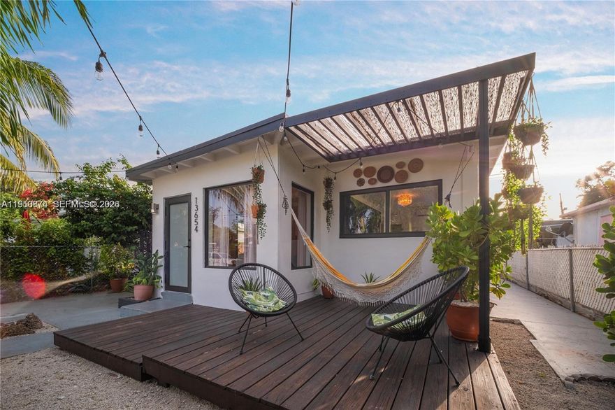 Welcome to "Sulito House!" If you're tired of apartment or townhouse living, you'll love living in your very own private stand-alone detached mid-century modern single-family home with fenced private gardens and NO HOA or Condo Association fees. Upon arrival, you’ll be transported to your own tropical paradise in this meticulously designed coach home with terrific indoor-outdoor living spaces. Inside, enjoy open living with a unique modern design, brand-new kitchen and spa-like designer modern bath suite, with one spacious bedroom plus a second tucked away bedroom. Outside, enjoy fenced parking, elegant covered patios, spacious dining space, BBQ den, and lush hammock-infused lounge space with Instagram-ready newly-constructed deck with artistic backdrop, with impact windows and doors for added peace of mind. All in your own private oasis in a fantastic booming location, near restaurants, shops and beaches of Aventura, North Miami Beach, Sunny Isles, and Miami Shores/The MiMo District.