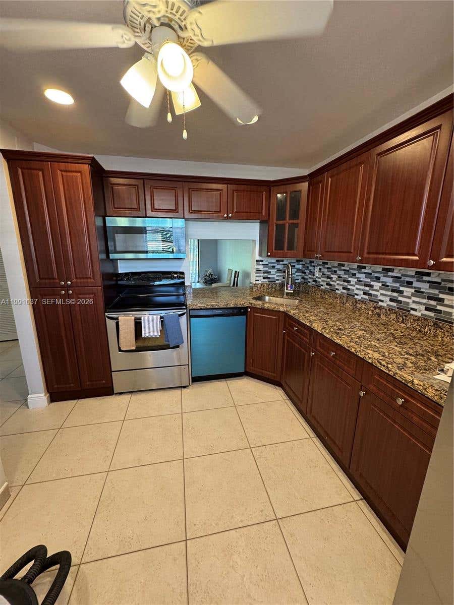 Photo of 6095 N Sabal Palm Blvd #104, Tamarac, FL 33319 (MLS # A11991037)