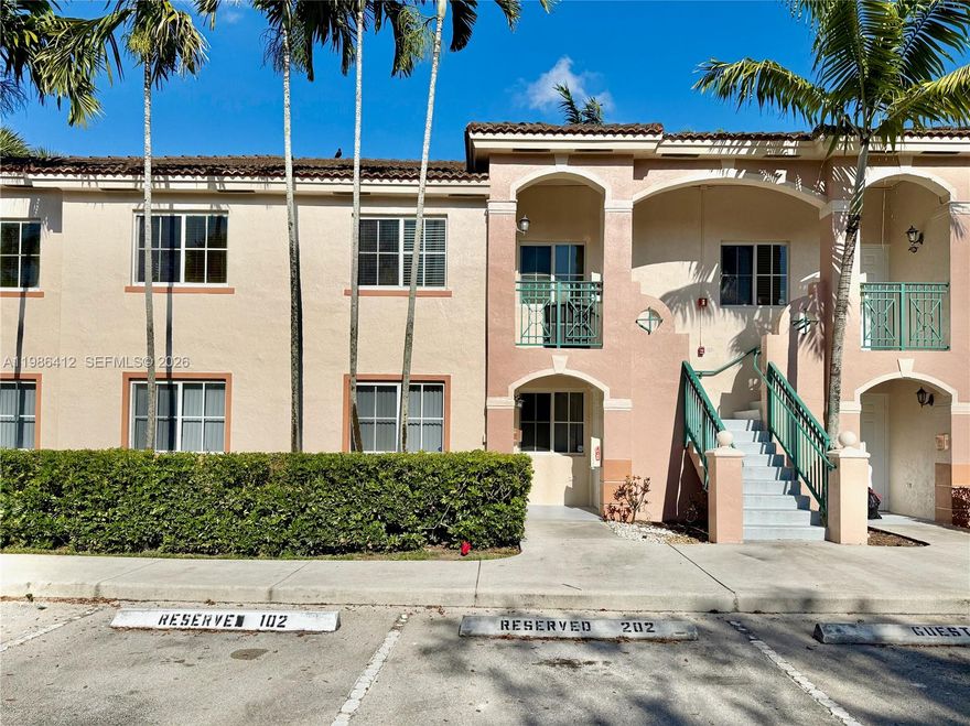 This 1st-floor lakefront condo offers an open layout featuring waterproof flooring, white cabinetry, and Calacatta quartz countertops in the kitchen and bathrooms. The unit is centrally located in a gated community with no rear neighbors, the unit includes stainless steel appliances, an in-unit washer and dryer, and a kitchen pantry, while both bedrooms have walk-in closets. The primary bathroom features a walk-in shower, the second bath has a soaking tub, and both bathrooms have porcelain tile throughout. Convenience meets comfort with assigned parking directly in front, an attic and storage room, hurricane shutters, and a private rear patio perfect for enjoying unobstructed lake views. Residents also benefit from a well-maintained environment with pool and BBQ amenities and ample guest parking.