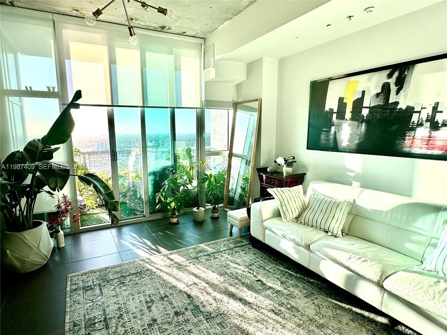 Spectacular modern open concept studio with amazing city views from large balcony, floor to ceiling windows. Night time view is mesmerizing with Miami lights. Den can be used as bedroom, laundry room is storage area. Vibrant Midtown is next to everything, Wynwood, Design district with luxury boutiques, restaurants and cafes. Trader Joe's is right down the street amongst other markets and shops, big box stores and little boutiques all walking distance. Building has club house pool and gym, assigned garage parking. Unit is beautifully furnished however if tenant does not want furnished landlord can lease it unfurnished or partially furnished, call listing agent to discuss.