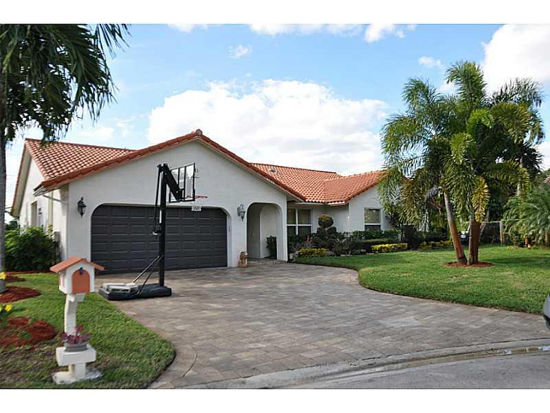 Has it All! Rebuilt in 11/2006. Located on Cul-de-sac, Newly paved driveway, Manicured Front Lawn. Oversized HUGE LOT. Wood Cabinets in Kitchen & Baths. Granite Countertops with stainless steel appliances. 20 Tile thru-out, Hurricane Impact Glass Win dows. Wooden Vertical and Venetian Blinds. Jacuzzi Master Tub, Eight Ceiling Fans with Lights. Pictures do not do this home justice! NO REO NO SHORTSALE! Close to Park and Schools. MOTIVATED SELLER!