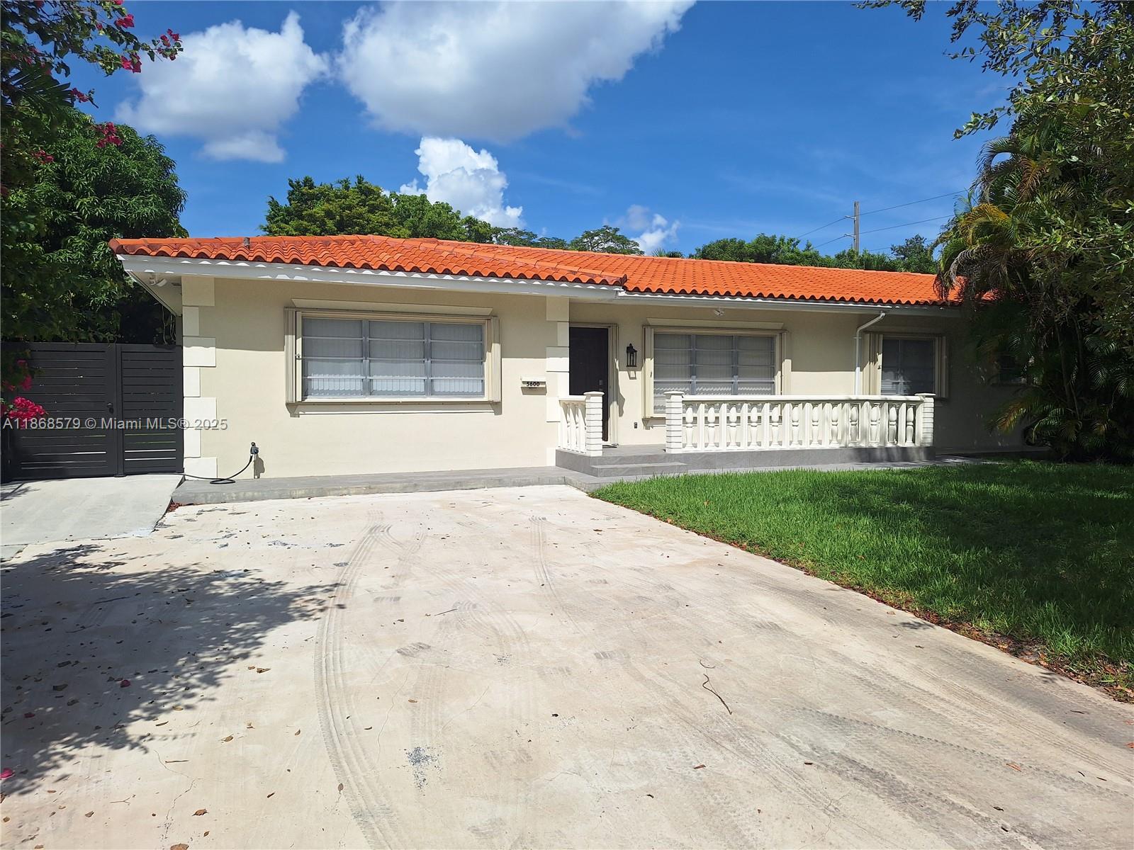 Beautiful, bright, and spacious duplex-like unit 2/2 plus an extra room that could be used as a third bedroom, family room, or office. There are a large kitchen and an inside laundry room. French doors lead to a covered terrace and a huge, fenced backyard. Yard maintenance is included. House is equipped with accordion hurricane shutters, and much more!!! Super central location close to UM, Gables, South Miami, shopping, and transportation.