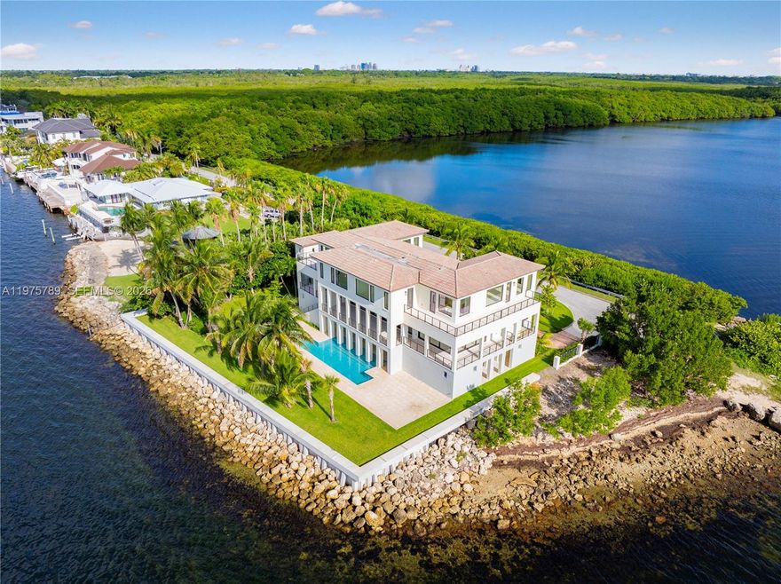 Tip of the World on Lugo Avenue.Gables by the Sea Breathtaking location paired with a stunning contemporary residence. From every room, enjoy unparalleled 360° views framed by floor-to-ceiling impact glass windows & doors. The entrance door itself is a true showpiece, opening into soaring ceilings & a seamless flow of light-filled spaces. Choose your moment: sunrise, sunset ,the sparkling Miami skyline by night.Elevated & elegant, master suite features a spacious balcony overlooking Biscayne Bay. All-new. All-white.Effortless floor plan designed for modern living.The pool deck offers endless water views, complemented by a seawall . Gables by the Sea is a gated community w/Coral Gables Police patrol. 24/7 security. 3D tours, Matterport & videos available. Come see it. Fall in love.