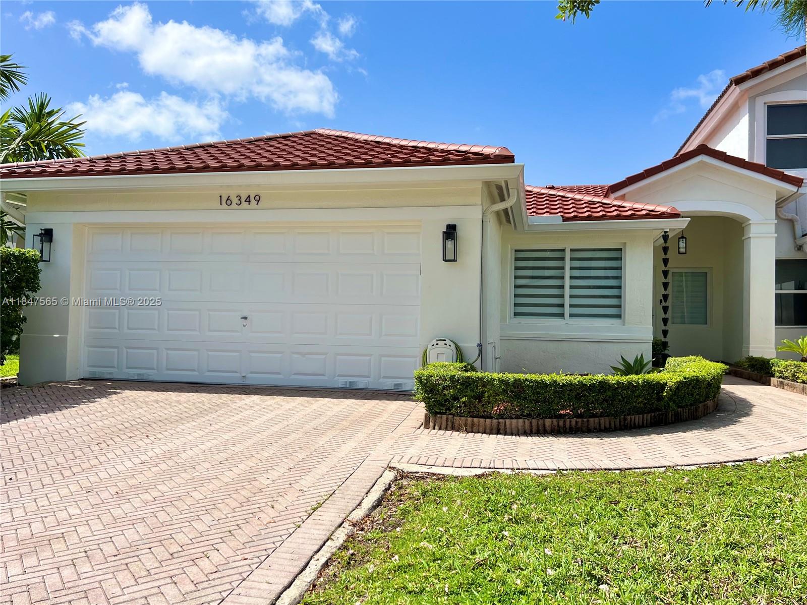 Stunning 1-story corner townhouse lives like a single-family home! With 1,909 SF of living space, this beautifully maintained 4-bedroom, 2-bath home offers a spacious open layout, no stairs, and exceptional flow throughout. Enjoy serene lake views from the living areas, plus a new roof in 2023 with 30-year warranty and high-impact Marvin windows in 2022 for peace of mind. The kitchen was remodeled in July 2025 with quartz countertops and matching backsplash. Both bathrooms were tastefully updated. Features include a 2-car garage, community pool, and guard-gated entry. Rarely available lakefront gem offers style, comfort, and security in one perfect package. Move right in and enjoy!