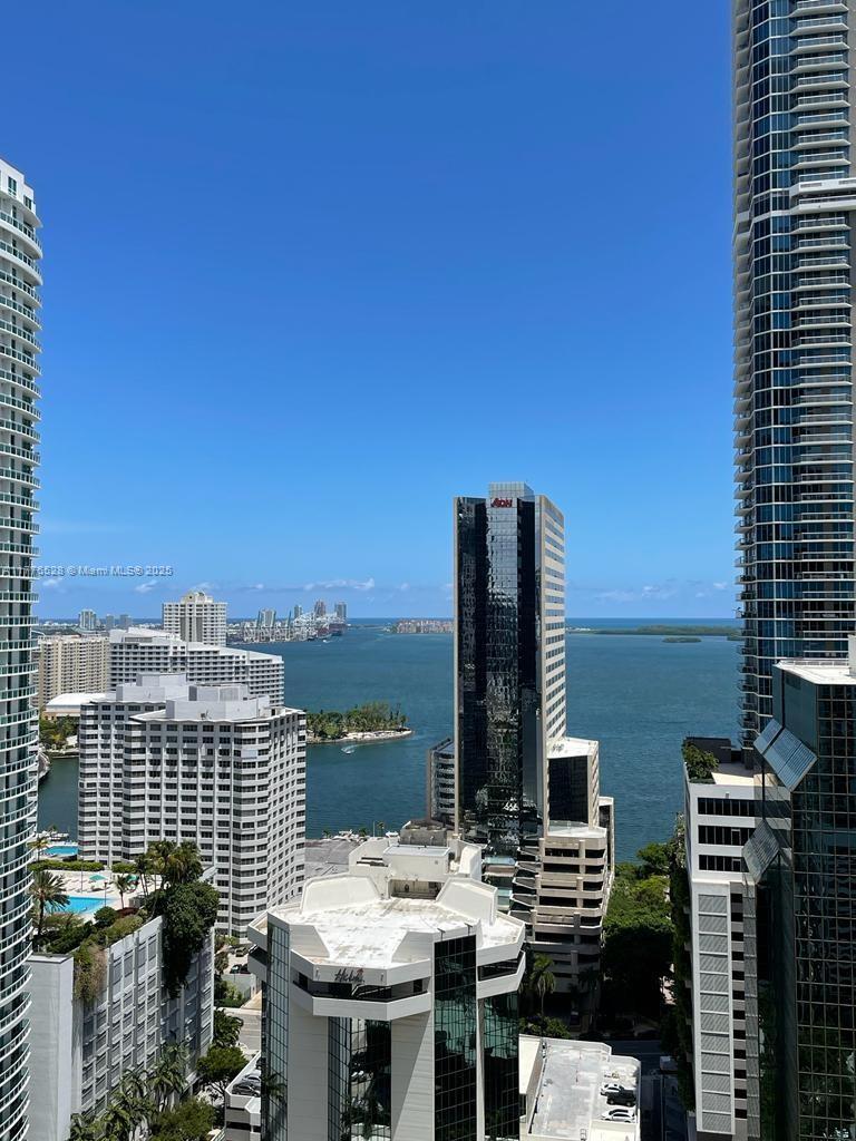 Spacious & bright 2/3 PLUS DEN at 1010 Brickell. European style open kitchen, porcelanato floors, bedrooms have bathrooms en suite, washer/dryer in unit, PRIVATE ELEVATOR & more. Enjoy the WATER & CITY VIEWS from its ample balcony, plus private balcony in the master. One of the only listings to have 2 PARKING SPACES. 1010 Brickell offers luxury at its best: 24 hour security, fitness center, rooftop swimming pool, Hammam spa, indoor heated swimming pool, 1/2 basketball & squash courts, arcade, kids playroom and more. Walk to work or play at this excellent location next to public transportation, entertainment, shopping & dining. UNIT CAN BE FURNISHED OR UNFURNISHED. Contact listing agent for showings.