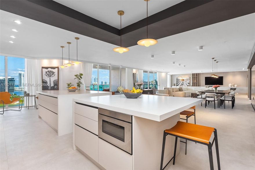 The Only One-of-One Trophy Combination Residence at Peninsula One. This bespoke renovated estate spans a massive 6,844 total SF, offering the scale of a private home with the elite luxury of Aventura’s premier waterfront tower. A true flow-through sanctuary, the residence features 6 bedrooms, 6 full baths, and 2 half baths. The heart of this home is an unmatched over 1,500 square foot Grand Entertaining Suite. This seamless environment merges a dining space, living room, and chef’s kitchen into one cohesive epicenter framed by floor-to-ceiling windows and breathtaking panoramas of the Atlantic Ocean and Dumfoundling Bay. Four balconies provide 703 SF of outdoor living for iconic sunrise and sunset views. The over 1,000 square foot Primary Wing is a masterclass in luxury. Designed as a self-contained retreat with its own balcony, this sanctuary features a boutique-inspired dressing room and spa-like bath. The floor plan includes a custom media room with refined Jade walls, a library, and a dedicated housekeeper’s suite. From exclusive-use elevator lobbies to the massive laundry suite, every detail is optimized for elite living. Residents enjoy 5-star amenities: spa, fitness center, pool, and café. A rare combination of units 1503 & 1504. An unprecedented trophy for the discerning.