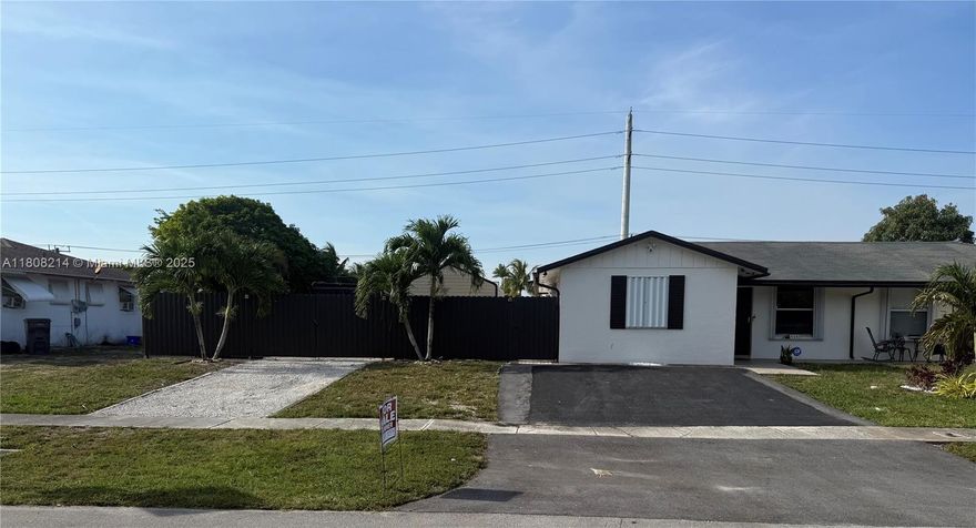 Centrally located in West Palm Beach. This 3 Bedroom, 2 bath home offers convenience & comfort. Tile floors throughout. The huge backyard was upgraded with brick pavers, ideal for entertaining, or simply relaxing. Additional highlights include electric vehicle charger. Accordion shutters for easy storm preparation. Near schools, shopping, dining, and major highways. LOW HOA. Easy to show.