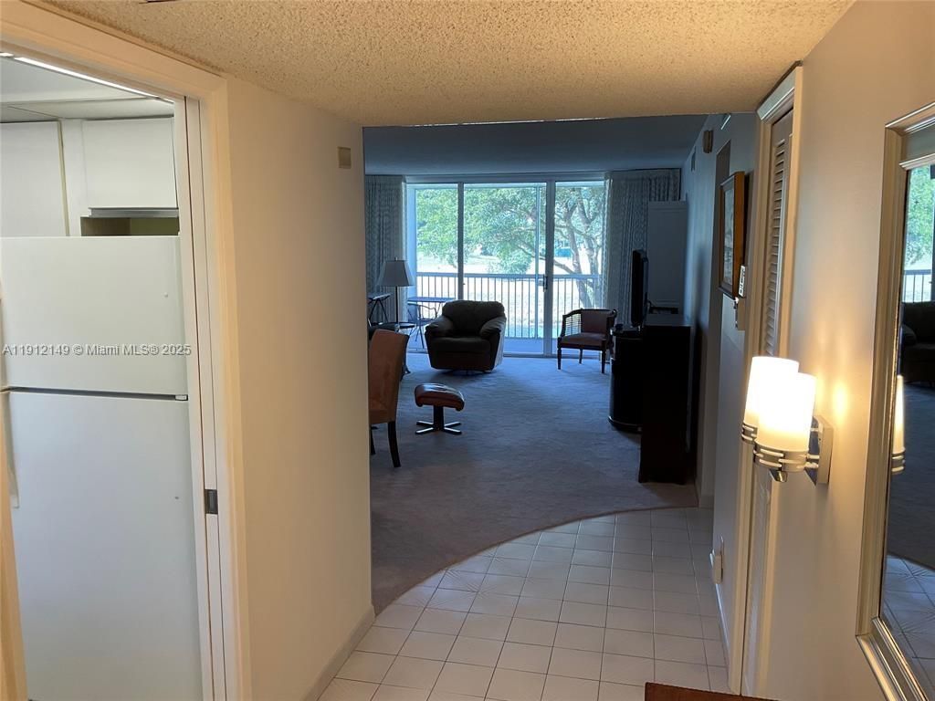 Photo of 3080 N Course Dr #209, Pompano Beach, FL 33069 (MLS # A11912149)