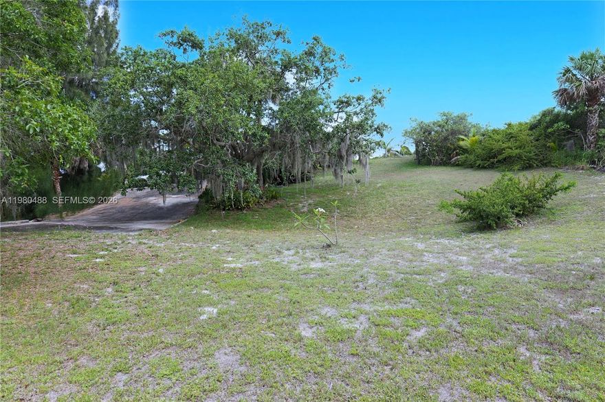Prime build-ready 22’ elevated 0.23-acre double lot (30 & 31) in desirable Hobe Sound – No flood zone, total 100' x 100' with 100' road frontage. Water & sewer hookups available on site. Located across Hobe Sound National Wildlife Refuge, minutes from pristine Atlantic beaches, the Intracoastal Waterway, top golf courses, and Jonathan Dickinson State Park. Cleared and primed for your dream home or investment. Black & white photo shows prior home from the 1970s (long removed).

Special opportunity: Adjacent lot to the west also for sale. Purchase both at a discounted price; Perfect for a larger estate or compound. Rare high-and-dry coastal lot. Don’t miss out!