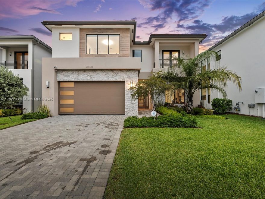 Discover the pinnacle of modern luxury in Boca Raton’s most prestigious gated community—Lotus Palm. This 5-bedroom, 5-bathroom Mariana model spans 3,888 sqft on a 6,821 sqft lot, with the developer’s premium offering during construction. Recently remodeled with high-end finishes and sleek modern upgrades, this home delivers elegance, comfort, and sophistication at every turn. Step inside to soaring ceilings, sun-drenched living spaces, and a gourmet kitchen with custom cabinetry, quartz countertops, and top-tier appliances. Spacious bedrooms, spa-like bathrooms, and refined designer touches make this home exceptional. Living in Lotus Palm means enjoying a resort-style lifestyle with a 30,000+ sqft clubhouse, resort pools, fitness center, tennis courts, kids’ zones, and community events.