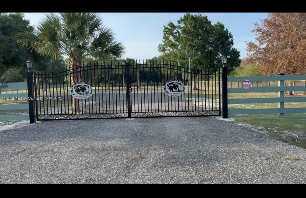 Beautiful corner lot in Montura Ranches, perfect place to build a getaway dream home in the country! Lot is entirely fenced with a permitted custom made iron gate entrance and permitted wide culvert. Lot has a paved entrance way with a pad ready to place a mobile home! Lot has been surveyed and certified by DEP for no areas of wetlands. New electrical post. Boating and Fishing is world renown on scenic Lake Okeechobee in addition, Montura Ranch Amenities offers a Club House with a community pool, picnic areas and play areas for children. Property is accessed on Horse Club Avenue, which is a paved road. A fantastic opportunity awaits to own this property and live the peaceful country life!