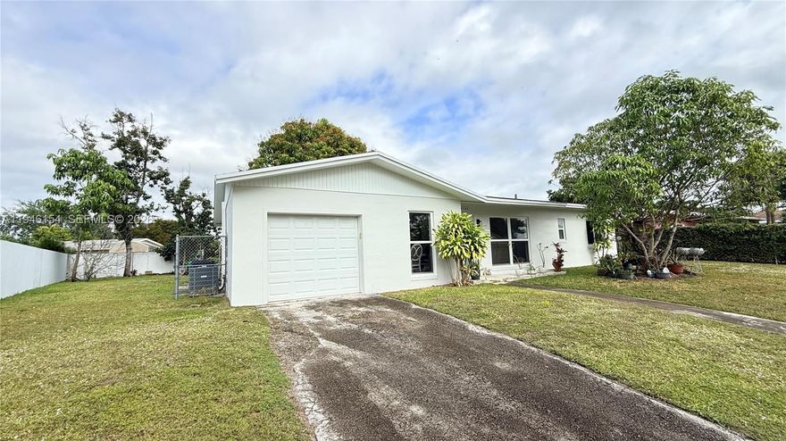 Charming and move-in ready 3-bedroom, 1-bath home offering comfort, functionality, and inviting living spaces. This home features an open and airy layout filled with natural light, creating a warm and welcoming atmosphere for everyday living and entertaining. Home offers Impact Windows and Doors, New AC Unit, and New updated kitchen cabinets. A one-car garage provides convenient parking and additional storage. Step outside to enjoy a generous backyard, perfect for relaxing, gardening, or hosting gatherings.  With a smart layout and room to make it your own, this home offers plenty of Space for a pool, RV, or boat.