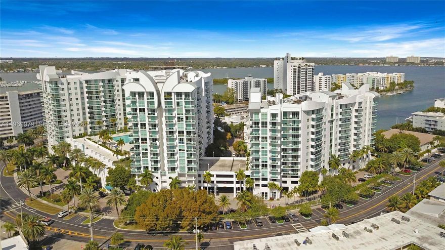 Experience resort style living at 360 Condominium in North Bay Village.  This exceptional corner residence offers a unique direct marina and waterfront exposure, with the water just steps away from your view.  Enjoy serene sights of swaying palm trees and sparking bay waters from nearly every angle of the home.  This spacious three bedroom, two bath condo features a bright open layout filled with natural light.  Elegant large format porcelain flooring, creating a seamless and sophisticated feel.  Unit offers 2 private balconies, 1 off the primary suite and a 2nd expansive corner balcony accessible from the living, dining and kitchen areas, perfect for enjoying morning coffee or evening sunsets overlooking the marina.  The kitchen showcases sleep black designer counter tops, custom cabinets and ample storage.  Generous closet space throughout the unit adds comfort and functionality.  Includes 2 covered parking spaces plus complimentary valet parking for visitors.  Residents at 360 enjoy luxury resort style amenities including 2 pools, and a jacuzzi, state of the art fitness center, 24 hrs security, concierge services, and more.  Centrally located just mins from downtown Miami, Beaches, fine dining, shopping, and major highways, offering the perfect balance for tranquility and convenience.