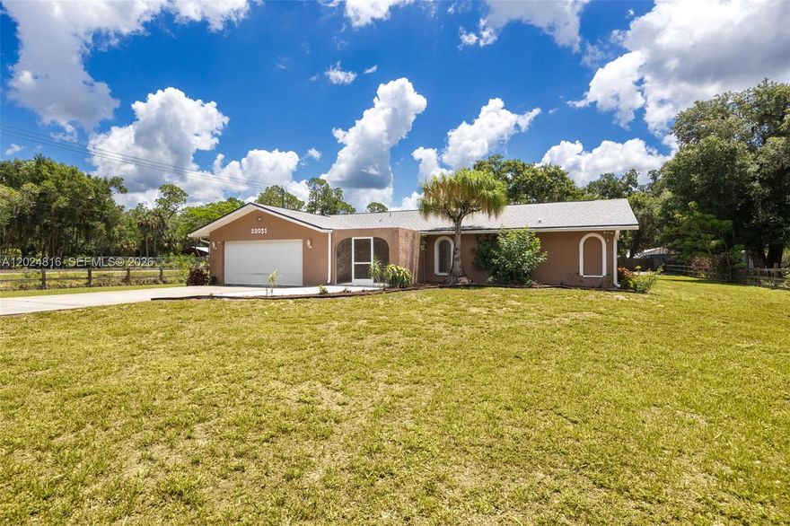 Nestled on a beautifully landscaped 1+ acre corner lot in charming Alva, this inviting pool home offers a private, gated retreat with easy access to S.R. 80 for effortless commutes to Fort Myers and LaBelle. Lush landscaping and mature fruit trees create a serene setting, while inside, a welcoming foyer opens to a spacious family room with sliding glass doors leading to the screened pool lanai—perfect for entertaining and enjoying Florida living. The split-bedroom layout provides privacy, and the open kitchen features an R/O water system for added convenience. Outdoor living shines with a large 15' x 30' pool, ample space to relax, and beautifully maintained grounds. Recent updates include a newer roof (2022), HVAC system (2021), and hot water heater (2024), along with tile and laminate flooring, upgraded lighting, and ceiling fans throughout. Located outside a flood zone for added peace of mind, the property also includes a large detached building with electric and water, plus an additional concrete slab for extra storage, equipment, or customization. Don’t miss this beautifully maintained Alva home where privacy, space, and natural beauty come together—schedule your private showing today!