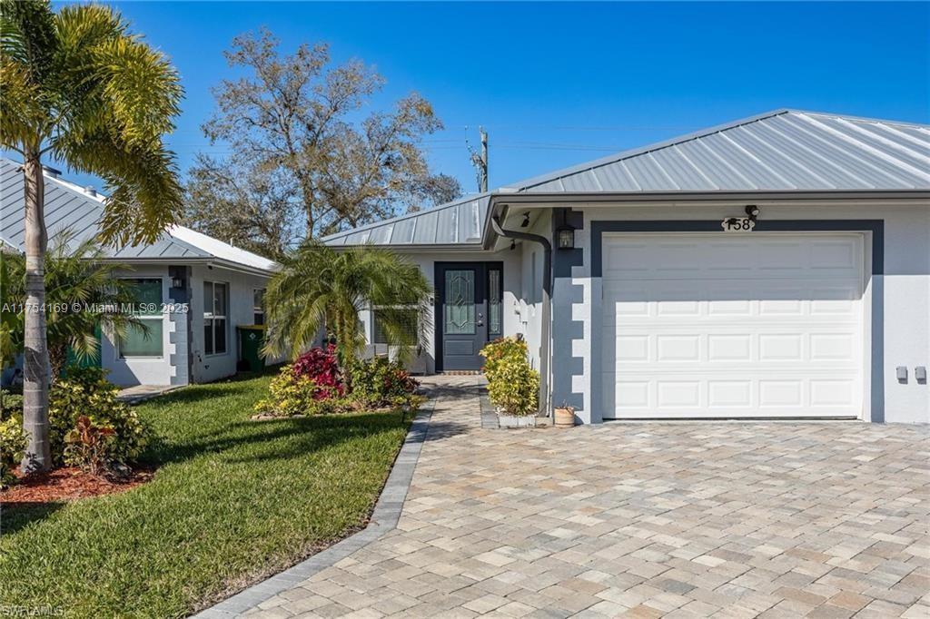 AN EXCELLENT STARTER/RETIREMENT HOME, RENTAL INVESTMENT OR CONVENIENT PLACE FOR A PARENT(S) OR EMPLOYEE. Come see this former Model Home! It's not only gorgeous & well taken care of it is concrete block construction & a seamless galvalume metal roof. This villa is energy efficient with solar roof exhaust fan & skylight. The stove, insta-hot water tank & dryer are all natural gas. It also comes with led lighting inside & low voltage accent lighting outside. Storm ready with hurricane impact windows & doors, fiberoptics, underground utilities & each room wired for TV. The spectacular kitchen has gray tone cabinets, granite countertops, island with bar seating, & stainless steel appliances. City Village allows you to relax & enjoy life without the worry of lawn or building maintenance!