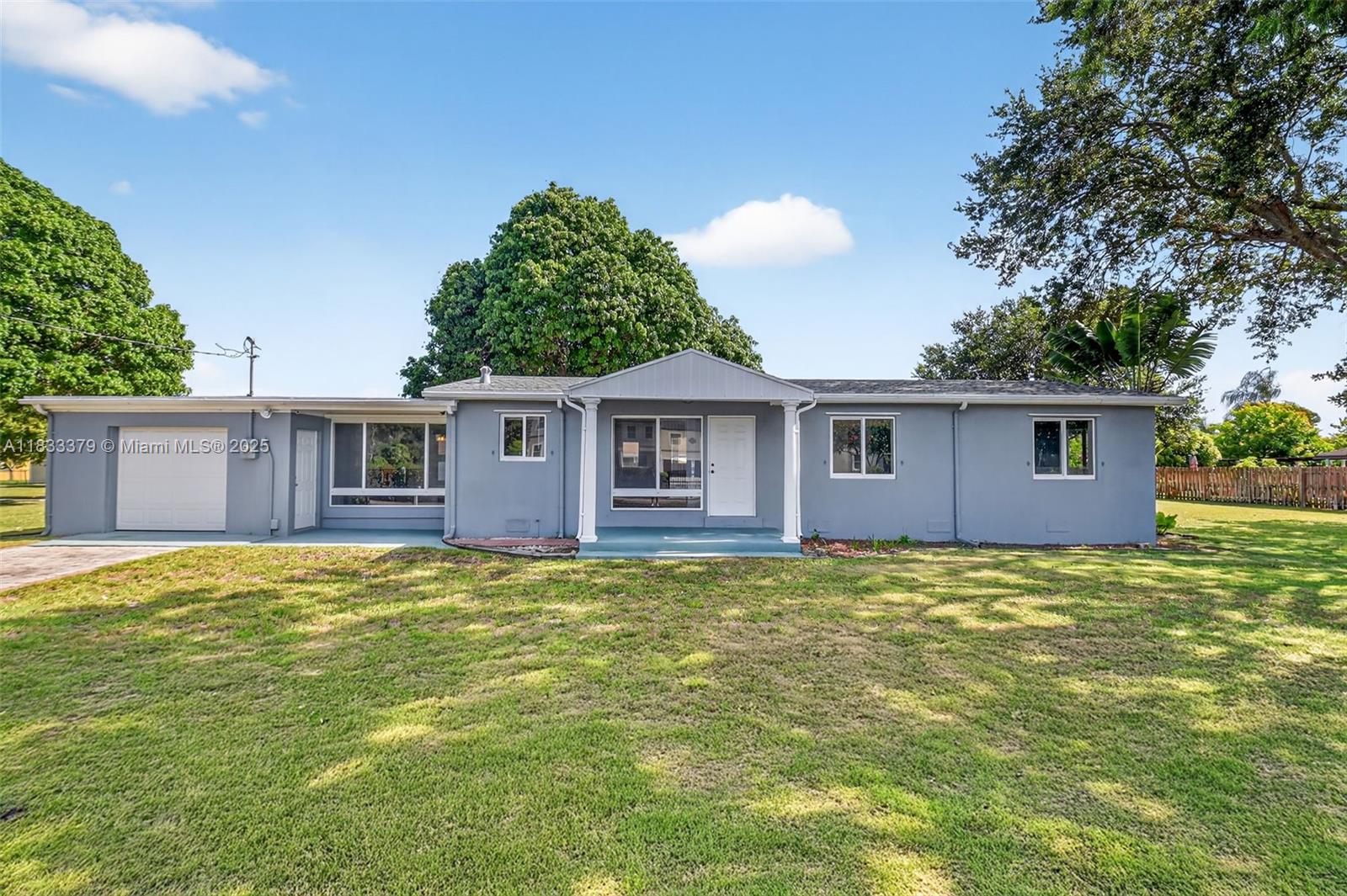 **INVESTMENT OPPORTUNITY** NO HOA** 3 Bedroom + Den, 2 Bathroom, 1 Car Garage, CBS HOME, Situated on 1 Acre of Prime Land Zoned Agri/Res. Home Features an Inviting Floor Plan, Updated Kitchen, Period Wood Cabinetry, Granite Countertops, Subway Tile Backsplash, Stainless Steel Refrigerator, Glass Range, Wall Oven, Spacious Bedrooms, Newly Renovated Baths, Contemporary Vanity, Glass Shower Enclosures, Custom Tilework, Modern Lighting, Additional Den/Office/Family Room ***IMPACT WINDOWS THROUGHOUT*** Beautiful Hardwood Oak Flooring & Neural Tile **2011 Roof**2023 A/C***2025 W/H** Garage Utility Suite, Open Porch, Mature Fruit Trees & Fenced Grounds. Home on City Water & Septic. Sewer Connection Ready at SE Corner of Lot. Centrally Located on Quiet Street