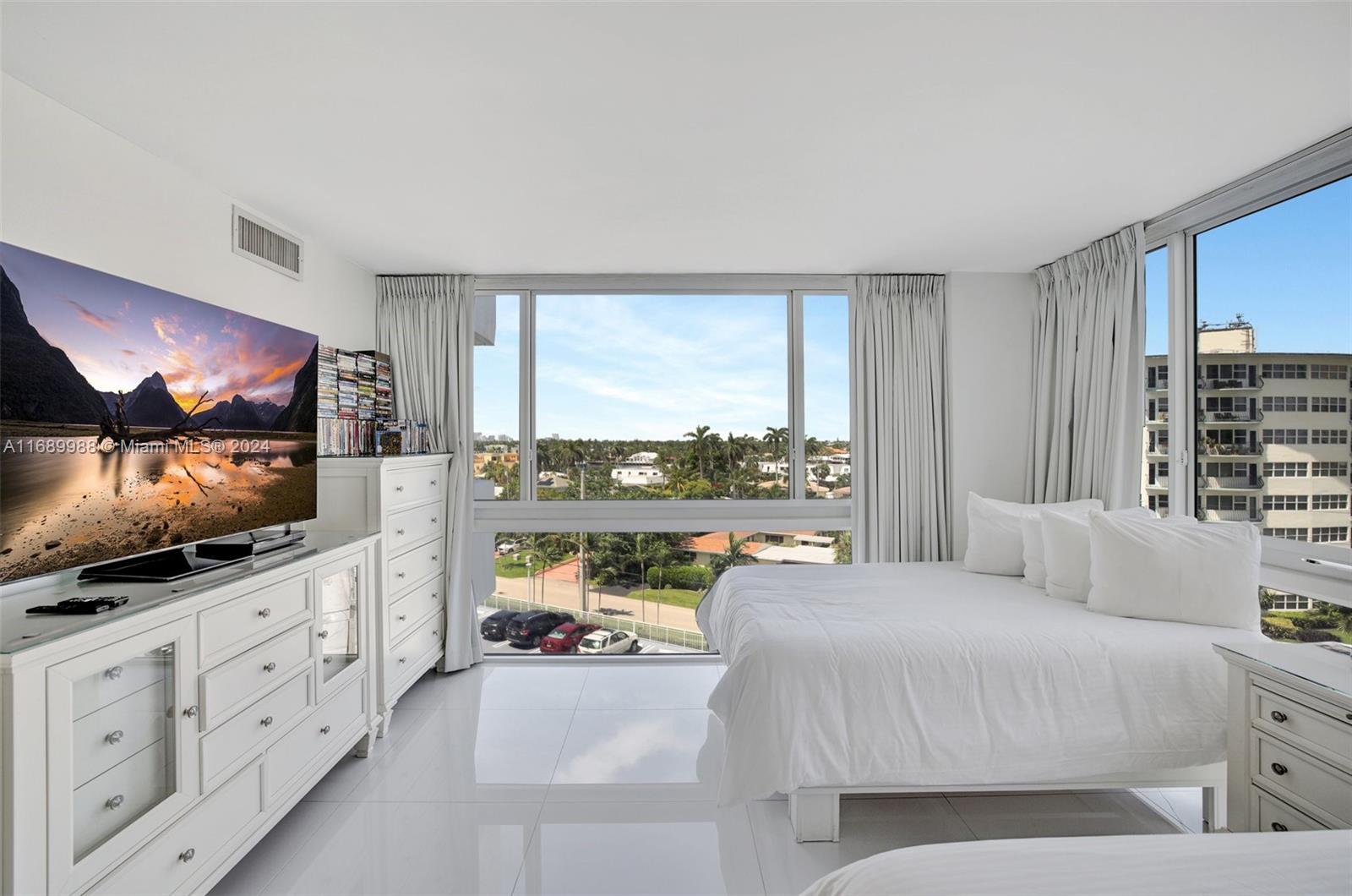 Welcome to this charming 2-bedroom, 2-bathroom condo nestled in the peaceful community of Fort Lauderdale Beach. Situated on A1A steps away from the sand this residence offers a blend of comfort and privacy with a view of the Intracoastal and ocean. Step inside to find a thoughtfully designed living space, highlighted by a recently renovated kitchen with natural stone countertops featuring elegant porcelain tile flooring and sleek stainless steel appliances. The spacious patio invites you to unwind and enjoy outdoor living, making it the perfect retreat for relaxation or entertaining guests. Located in a prime area, this condo offers an exceptional quality of life, close to all the amenities that make Fort Lauderdale such a desirable place to live.
