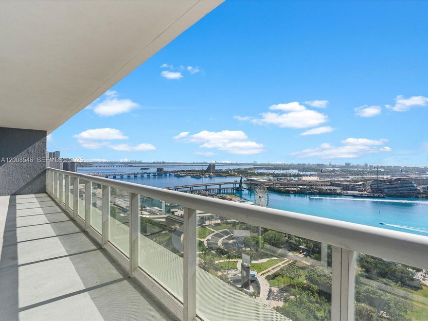 Experience sweeping panoramic views of Biscayne Bay and the Miami skyline from this exceptional high-floor residence, ideally situated in the heart of Downtown. This bright and spacious 1,357SF 2-bedroom + den home is filled with natural light and features a desirable open-concept layout, perfect for both relaxing and entertaining. The contemporary kitchen is outfitted with premium stainless-steel appliances, granite countertops, and abundant cabinetry. Floor-to-ceiling windows enhance the space, while capturing stunning sunrises and vibrant city views. The primary suite serves as a private retreat, offering generous closet space and a well-appointed bathroom with dual vanities, a soaking tub, and a separate glass-enclosed shower. The secondary bedroom functions as a junior suite, comfortably accommodating a king-size bed and featuring a walk-in closet. Residents of 50 Biscayne enjoy an array of resort-style amenities, including a state-of-the-art fitness center, spa, infinity-edge pool, 24-hour concierge, and valet service. Just steps from Bayfront Park, and surrounded by top-tier dining, shopping, and entertainment, this residence delivers the ultimate Miami lifestyle with unmatched convenience.