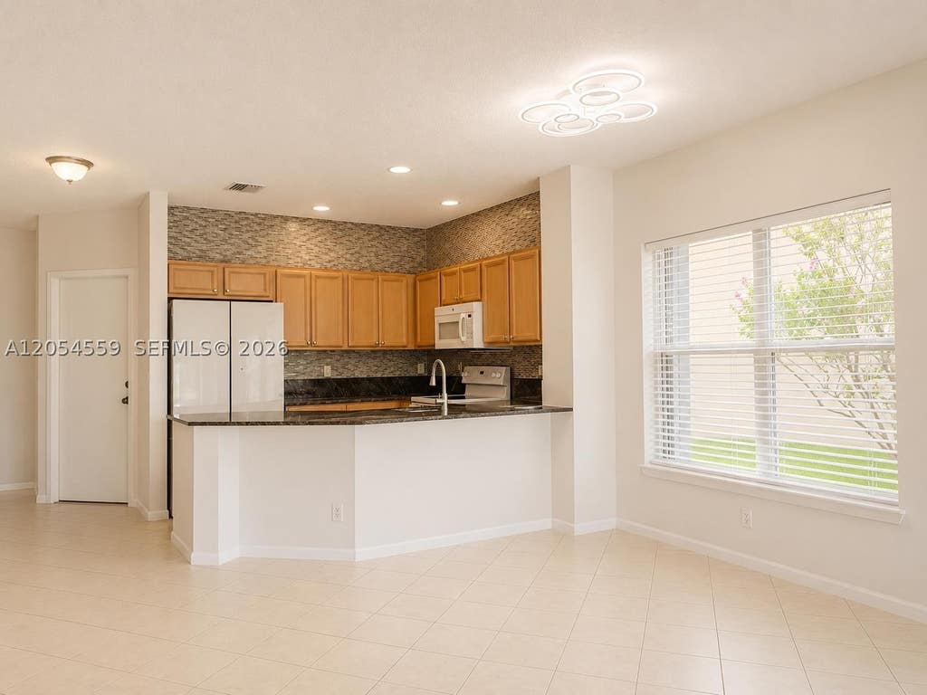 Photo of 7337 Smithbrooke Dr, Lake Worth, FL 33467 (MLS # A12054559)