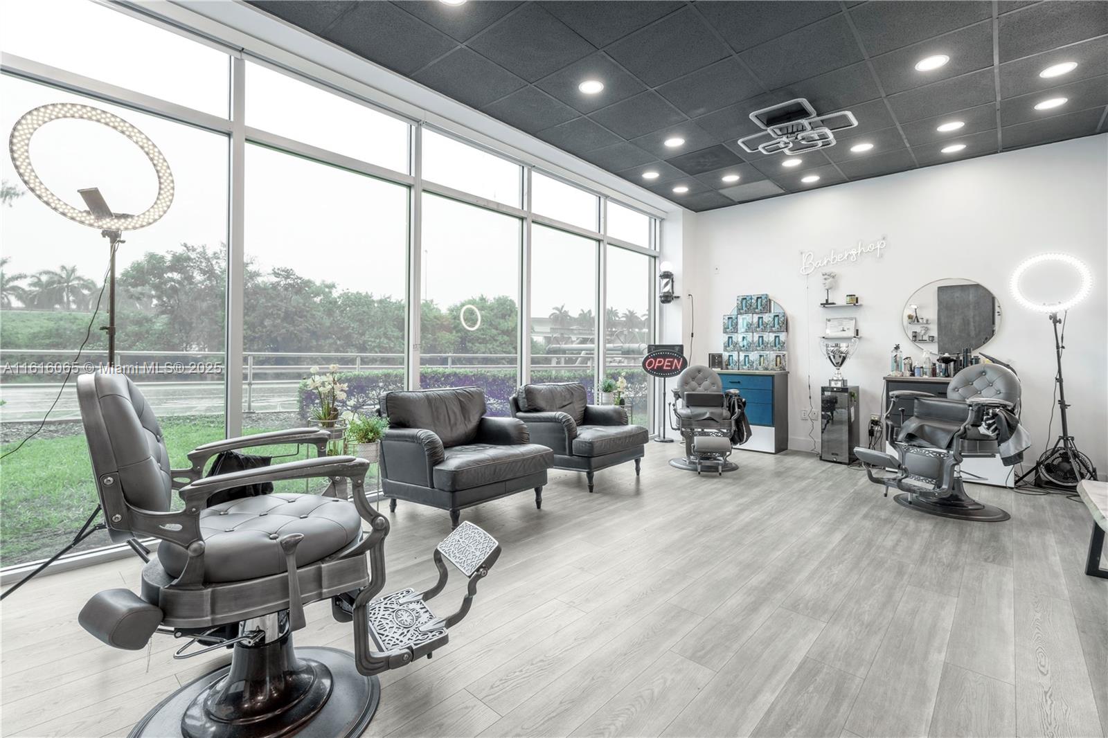 Exciting business opportunity! This spacious first-floor barbershop features 5 chairs, a welcoming waiting area, and a charming drink station. The building includes convenient parking, a lobby, and an open vending/eating area. Located in a prime spot near major highways, this is a fantastic chance to grow your business.