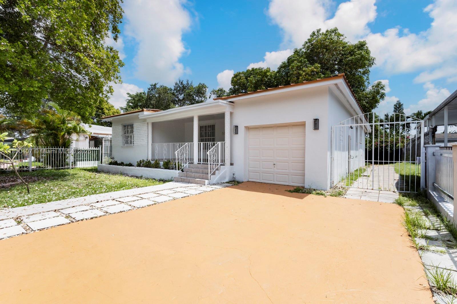 This beautifully renovated home features 4 bedrooms, 2 bathrooms, a split-plan layout, and a rare 1-car garage in the heart of Little Havana. With over 2,000 sq. ft. of living space on a 6,500+ sq. ft. lot, the versatile floor plan is ideal for multi-generational living. The home has elegant flooring, fully updated bathrooms, and a modern kitchen. The gated property is enhanced by mature canopy trees, including two mango trees, creating a charming and shaded outdoor setting. Situated in one of Miami’s most iconic neighborhoods, this home is steps from Little Havana’s vibrant culture, dining, and entertainment, and just minutes from Downtown, Brickell, and other city attractions.