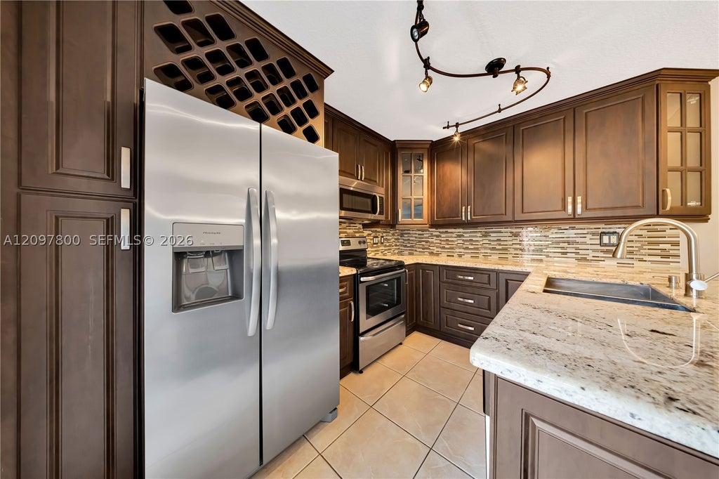 Photo of 11915 SW 13th Ct #11915, Davie, FL 33325 (MLS # A12097800)