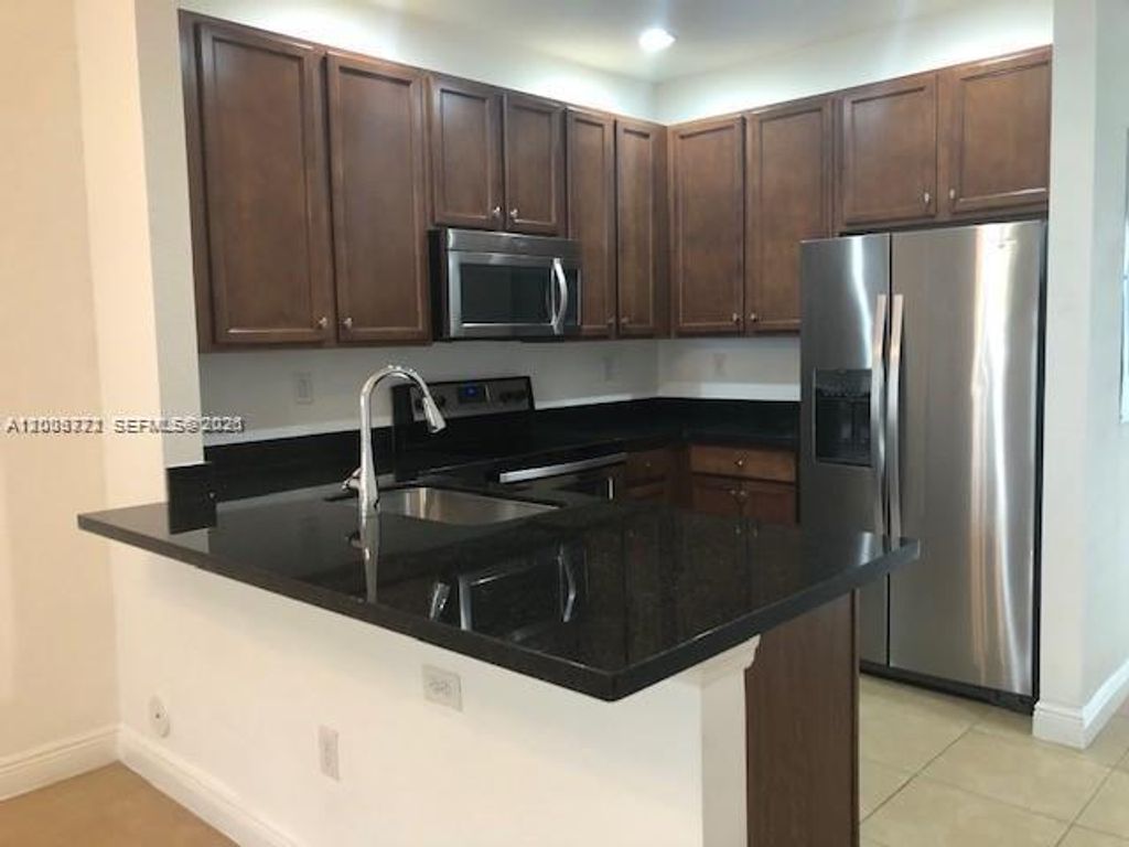 Photo of 1028 SW 147th Ave #10609, Pembroke Pines, FL 33027 (MLS # A12003772)