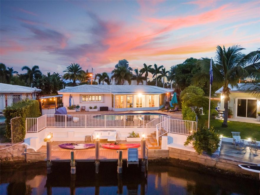 Breathtaking sunsets and the best long canal views await in this furnished 3BR/2BA single-story home. Just three houses from the Intracoastal, enjoy deep water access with no fixed bridges, a seawall, and a 35’ concrete dock with water and electric. Nearly a ¼-acre lot with heated pool, deck, covered outdoor bar, and screened Florida room. Interiors feature a renovated kitchen, updated baths, spacious living areas, and marble patios. Master suite with ensuite shower; second king bedroom shares a hall bath with a kids’ room with twin trundle beds. Additional features: washer/dryer, storage room, attached garage with automatic door, new asphalt driveway, and 2016 concrete S-tile roof. Equal Housing Opportunity.