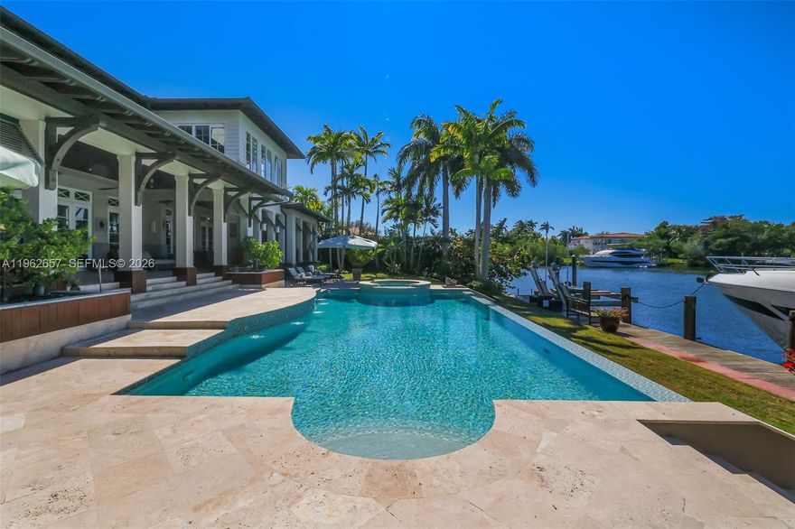Island sophistication meets elevated coastal design in this acclaimed Ramon Pacheco home, styled with crisp finishes, warm textures, and modern comfort. Perfectly positioned on a very private, wide canal off the turning basin—with no bridges to the bay, this is a true boater’s retreat in gated Old Cutler Bay featuring a 140' seawall and full service 100' dock. Outdoor living shines with a heated salt-system pool and a fully equipped summer kitchen complete with a roasting asador, barbecue, and large burner for effortless entertaining under the Florida sky. Inside, gorgeous natural light and a smart layout deliver grand scale and flexibility: 6 bedrooms plus a large office, 7.5 bathrooms, and an additional room easily convertible to a bedroom. The home was expanded in 2019, enclosing the upper terrace to create a sunroom off the primary suite, currently used as a gym and partially enclosing the lower terrace to create a generous office and guest suite. An upstairs second family room adds another family space, while an elevator provides easy access to every level. Additional highlights include a wine cellar, smart-home features, a full house generator, and a 3-car garage with lift. A unique opportunity to own in coveted Old Cutler Bay amid dramatically increasing property values—privacy, design, and waterfront lifestyle in one exceptional offering.