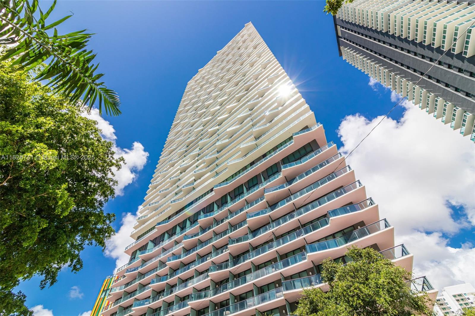 Stunning corner unit at the world-renowned SLS Brickell featuring a wrap-around balcony with breathtaking skyline and bay views from every room. This 3 bed + den, 2.5 bath residence offers an open floorplan, Miele & Bosch appliances, porcelain floors, custom walk-in closets, electric blinds, and a spacious gourmet kitchen. Enjoy luxury living with rooftop and resort-style pools, cabanas, spa, 5-star fitness center, private theater, kids’ playroom, party room, and 24/7 valet, concierge, and security. Includes assigned garage parking, in-unit washer/dryer, and exclusive resident access. Located steps from Brickell’s top restaurants, shops, and nightlife. High-speed internet, cable, and water included.