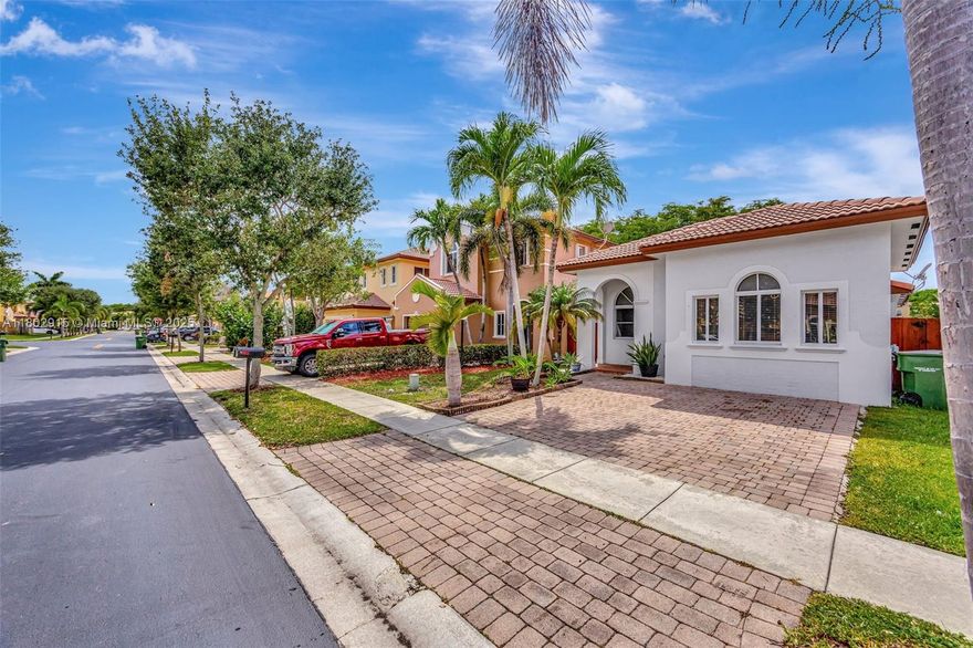 Beautiful single-family home located in one of the most desirable gated communities in Homestead. Remodeled kitchen & bathrooms, granite countertop, porcelain throughout the house. In one of the bedrooms, the wall and door were removed to create an additional area for family enjoyment, easily restored back to a bedroom. The property offers access to the canal from the backyard fence. Very low HOA includes your private backyard lawn mowing every two weeks.  Enjoy the Waterstone Grand Clubhouse, pool, and playground.