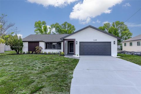 Photo of 1648 Coral Point Dr, Cape Coral, FL 33990 (MLS # A12027958)