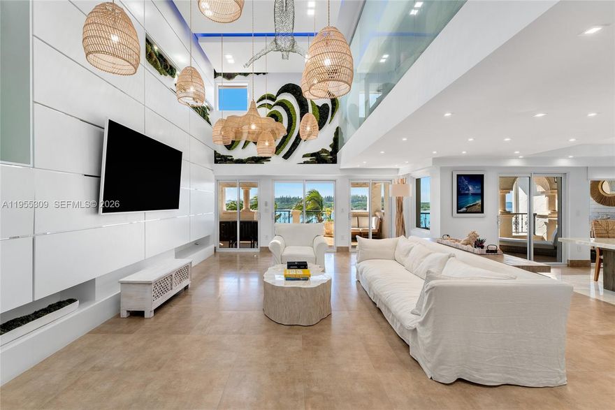 This stunning and beautifully renovated 2-story penthouse offers 3BR/3.5BA & 3,227 SF. Features dramatic double-height ceilings, exquisite stone floors throughout & 4 private terraces w/open bay, Virginia Key, city & ocean views. Spacious open living room boasts soaring ceilings, custom millwork & flows seamlessly w/dining area boasting a large saltwater wall aquarium. Chef’s kitchen sports granite island, custom cabinetry & top-tier Viking appliances. 2 BRs downstairs w/ensuite baths. Elegant staircase leads to principal suite encompassing the entire second level with a private bayside terrace, & spa bath w/infrared sauna, walk-in shower, Jacuzzi tub, & custom Ornare closet upgrade planned. A private rooftop lounge w/seating areas, cold plunge, & city views complete this amazing unit.