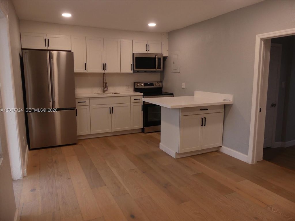 Photo of 161-165 NW 40th St #4, Oakland Park, FL 33309 (MLS # A12007324)