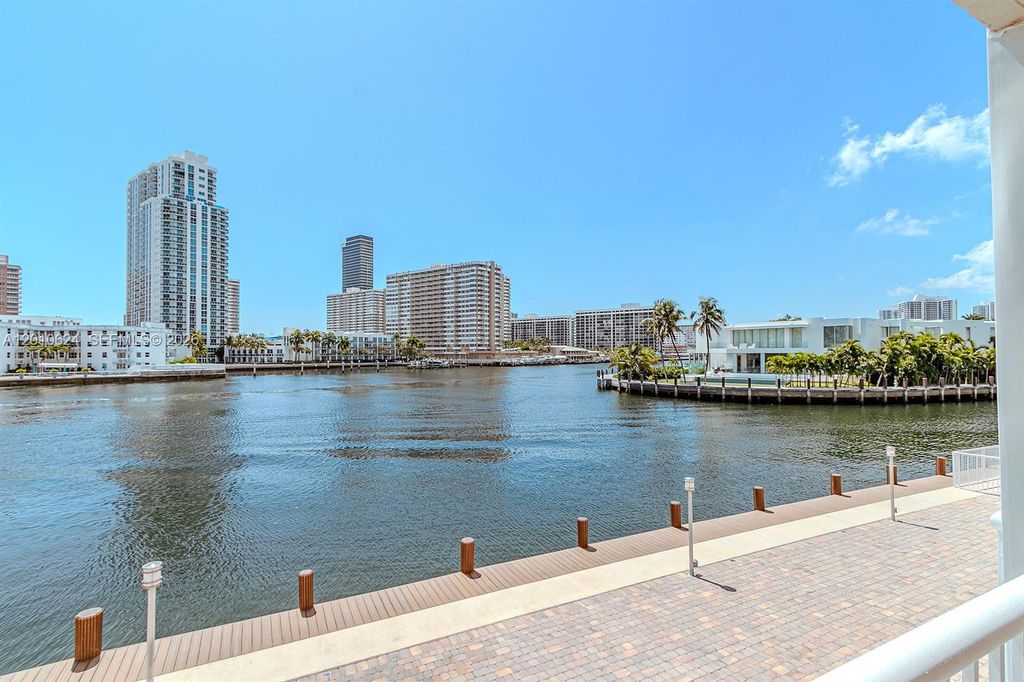 Photo of 121 Golden Isles Dr #104, Hallandale Beach, FL 33009 (MLS # A12010624)