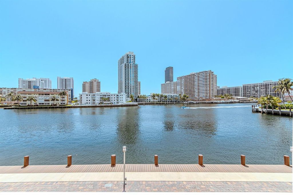 Photo of 121 Golden Isles Dr #104, Hallandale Beach, FL 33009 (MLS # A12010624)