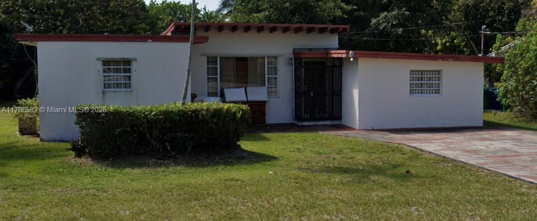 Spacious 4/2 home located in quiet neighborhood, large backyard, tile floors, updated kitchen, new roof. Great for a large family.