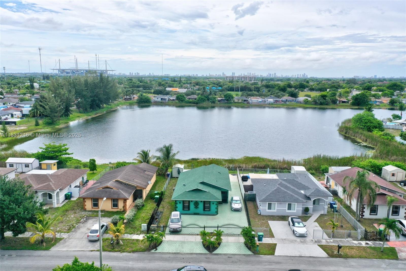 Spacious 4-bedroom, 2-bath single-family home located in the heart of Miami Gardens. This well-maintained residence features a bright open layout with tile floors throughout, an updated kitchen, and generous living and dining areas perfect for entertaining. The split-bedroom floor plan offers privacy, and the large backyard is ideal for outdoor gatherings, play, or relaxation. Driveway provides ample parking. Conveniently located near major highways, Hard Rock Stadium, shopping, schools, and parks. A great opportunity for owner-occupants or investors alike!