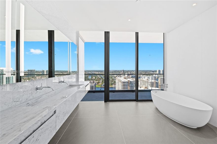 Magnificent corner flow- through residence on 27th floor of this boutique ocean front luxury glass tower. Perched high above surrounding buildings, this half-floor residence boasts 2,913 sq ft of interior space & 475 sq ft of terraces offering expansive 360 views of ocean, city, & intracoastal views form the expansive east and west terraces. Personal service, privacy & luxury amenities are the key to this 64 unit tower. 2 private elevators, Boffi kitchens, Gaggenau appliances, B&B Italia closets, & full unit professional water filtration system. Resort-Style Amenities east and west facing pools, state-of-the-art gym, spa, yoga studio, beach * pool services, 24-Hour Concierge. Large dogs allowed. Minutes from Aventura & Sunny Isles. Mid way to Fort Lauderdale & Miami airports