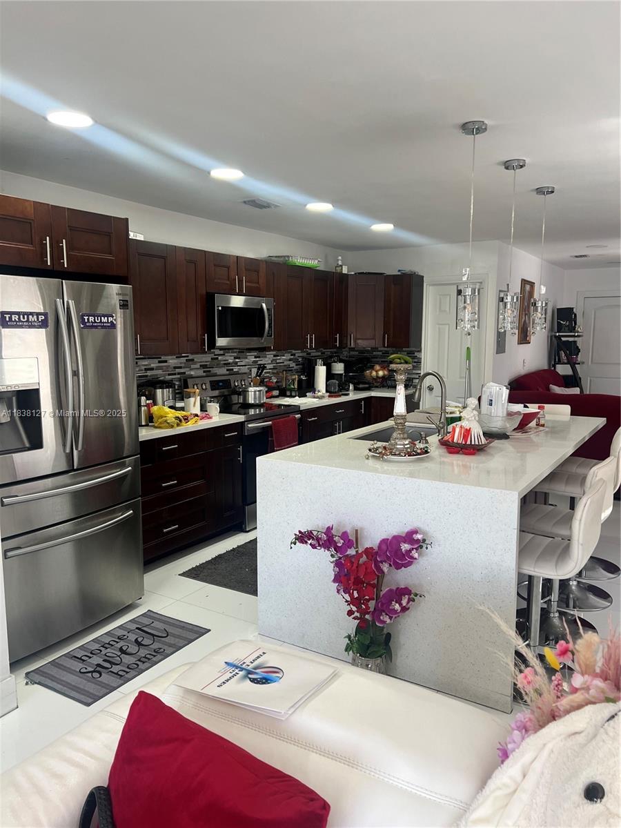 BEAUTIFUL HOME!! LOT OF POTENTIAL Impact windows. perfect home for a large family, 3/2 with in-law quarters. Great location with close proximity to Florida Turnpike, 836 Expressway, dolphin mall, FIU and many shops and restaurants.
Text listing agent for showing instructions..