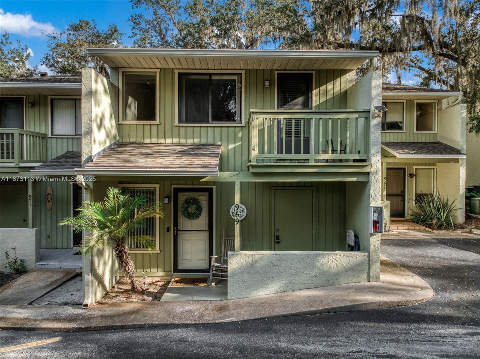 Welcome to this stylish townhouse offering lake access and great amenities in a prime Sebring location! Set in a landscaped community, residents enjoy Lake Jackson access plus a pool and dock just steps away. This two-story home has two bedrooms and two full baths upstairs, providing comfort and privacy. The main level features tile flooring, a kitchen with solid-surface countertops, wood cabinetry, and a wet bar with glass-front cabinets. A half bath is convenient for guests, while sliding doors open to a screened patio, perfect for relaxing or entertaining. A charming walkway leads to the pool and lake, where you can swim, fish, or enjoy the view. Close to downtown Sebring, this home offers modern updates and a prime location for year-round living or a seasonal retreat.