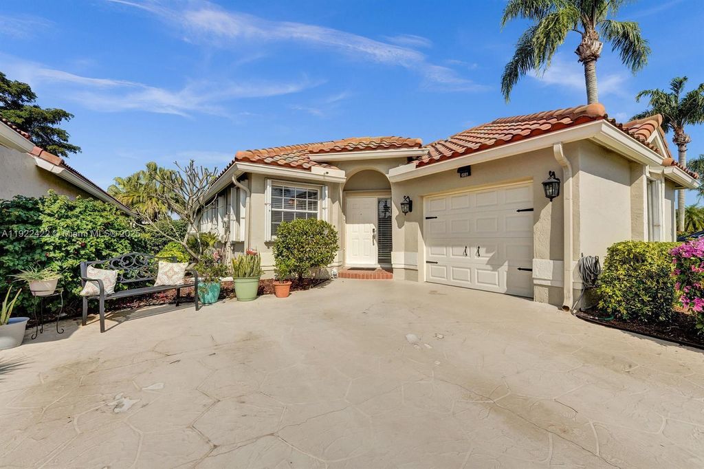 Photo of 6081 Bluegrass Dr, Boynton Beach, FL 33437 (MLS # A11922422)